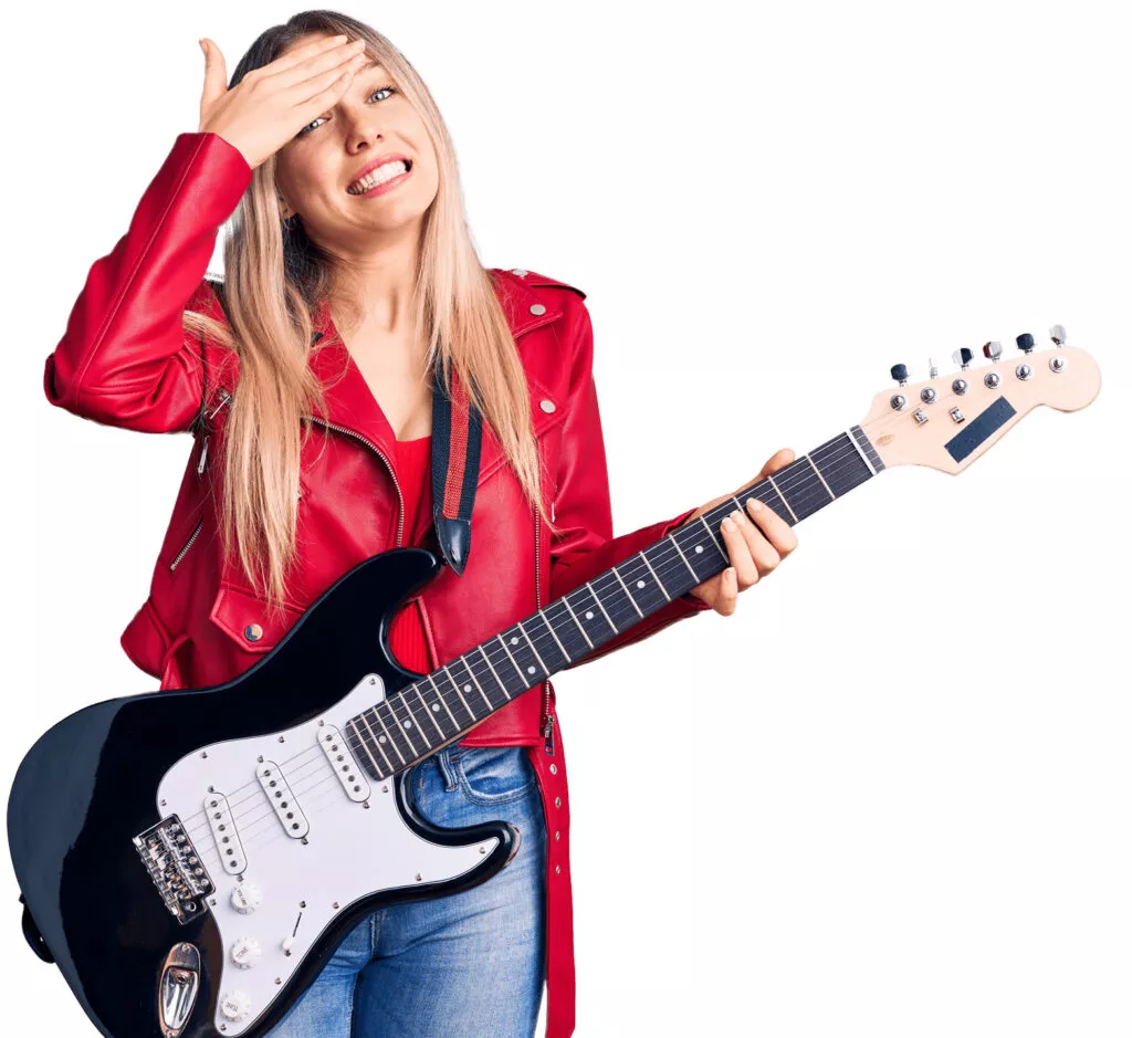 Student guitarist preparing for auditions with music college admissions help