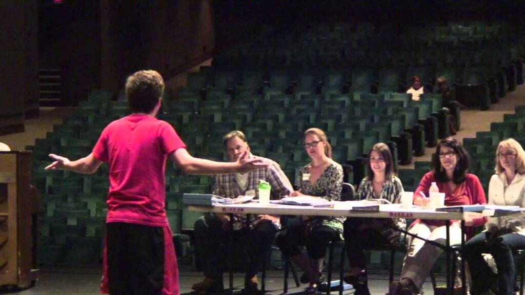 student performing at a college music audition
